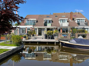 Guesthouse BedNboot met terras aan het water